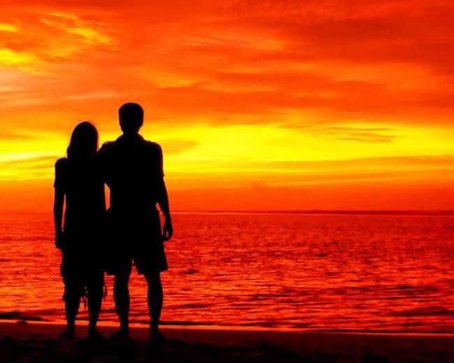Couple in sunset beach