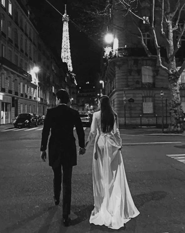 Couple walking in Paris streets