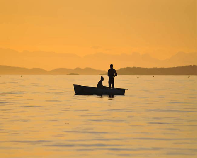 Couple in boat silhouette